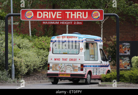 An Ice Cream van drives through a Burger King drive thru at a restaurant in Hove, Britain. Picture by James Boardman Stock Photo