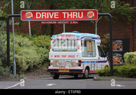 An Ice Cream van drives through a Burger King drive thru at a restaurant in Hove, Britain. Picture by James Boardman Stock Photo