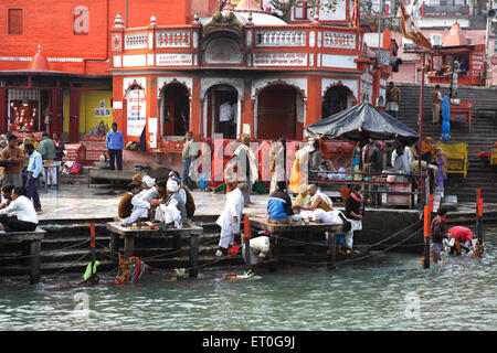 People performing rituals on banks of river Ganga ; Haridwar ; Uttaranchal Uttarakhand ; India Stock Photo