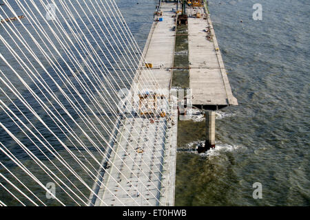 View of under construction Bandra Worli sea link is 8 lane twin carriageway cable stayed bridge ; Bombay Mumbai Stock Photo