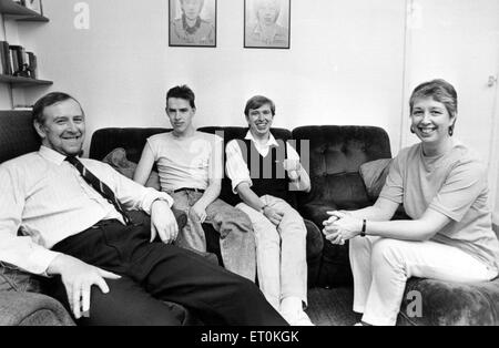 Dave Yewlett, who was in a near-fatal road accident five years ago, and went on to win sporting medals despite being wheelchair-bound. Pictured here is the Yewlett family at their home in Pen Y Dre, Rhiwbina, Cardiff. From left, John, sons Philip (19) David (21) and his wife Helena. 28th April 1987. Stock Photo