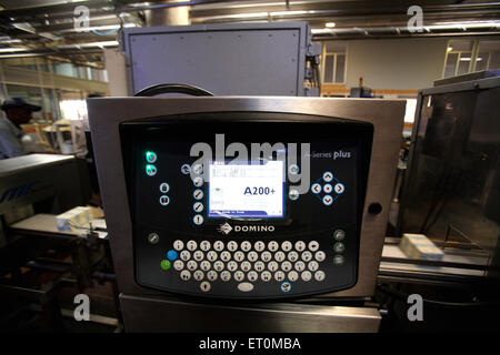 Computerized weighing machine, Amul Factory, Anand, Gujarat, India Stock Photo