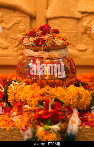Urn containing ashes of father of nation ; Mahatma Gandhi kept amidst of flowers for public display at Mani Bhavan Stock Photo