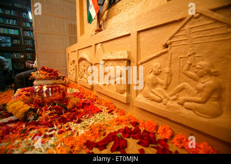 Urn containing ashes of father of nation ; Mahatma Gandhi kept amidst of flowers for public display at Mani Bhavan Stock Photo