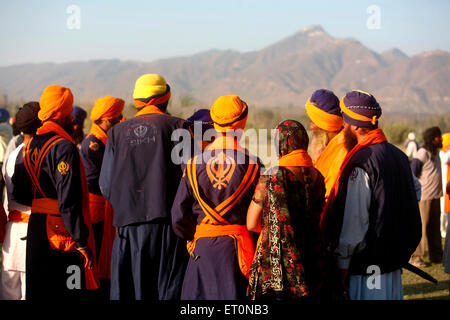 Nihangs or Sikh warriors during the Hola Mohalla celebration at Anandpur sahib in Rupnagar district ; Punjab ; India Stock Photo