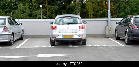 Bad inconsiderate parking, (or a good reason?) at roof level in a full pay and display multi storey public car park at a NHS hospital Essex England UK Stock Photo