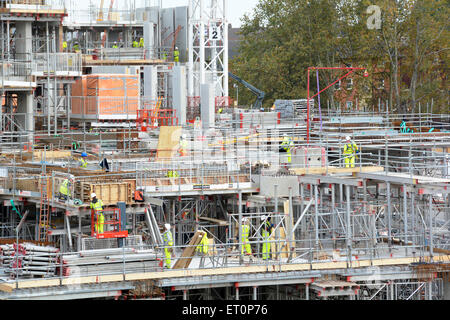 Construction site modular formwork and scaffolding units in use on construction of building superstructure South London England UK Stock Photo