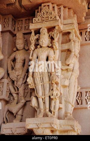 Idols carved in wall stone in deval ; Mandore ; Jodhpur ; Rajasthan ; India Stock Photo