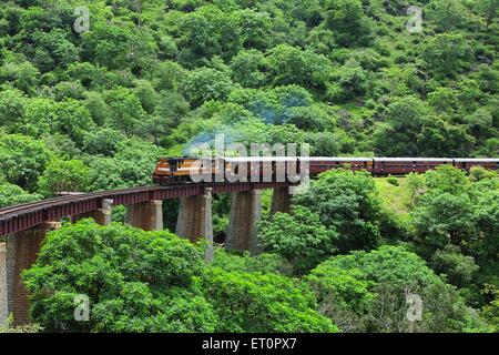 Train running on bridge ; Goram ghat ; Marwar Junction ; Rajasthan ; India Stock Photo