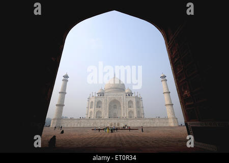 Taj Mahal from arch of guesthouse mehman khana ; Agra ; Uttar Pradesh ; India Stock Photo
