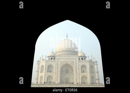 Taj Mahal from arch of guesthouse mehman khana ; Agra ; Uttar Pradesh ; India Stock Photo