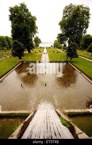 Fountains in mughal garden nishat bagh ; Srinagar ; Jammu and Kashmir ; India Stock Photo