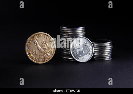 concept of Indian Rupee and American Dollar coins Stock Photo