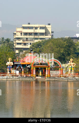 Colourfully painted Mahadeo Dhyan mandir ; lord Shiva meditation temple built on island inside Masunda lake Thane Stock Photo