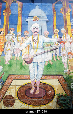 Saint tukaram singing holy song hymn painted on glazed tiles in pasodya vitthal temple ; Pune ; Maharashtra ; India Stock Photo