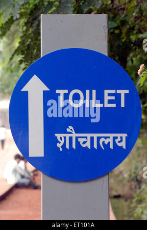 toilet sign in english and hindi blue white letters round board Stock Photo