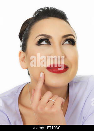 Portrait Of A Very Thoughtful Beautiful Hispanic Young Woman Considering Some Issues or Situation Against White Stock Photo