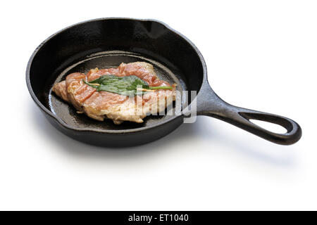 saltimbocca alla romana ( cooked veal, prosciutto and sage ) on skillet Stock Photo