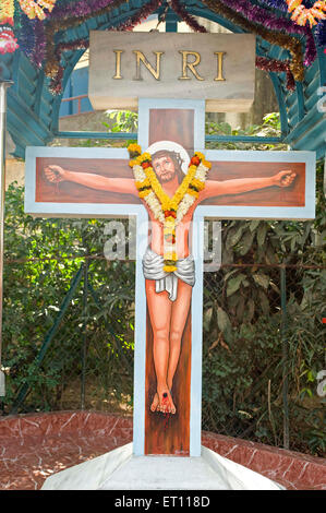 Crucifix Jesus Christ on Cross painted at Mumbai Maharashtra India Asia Stock Photo