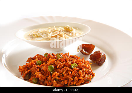 Islamic festival ; celebrate Ramzan ID ; food biryani ; khajur and sevian kheer ; India Stock Photo