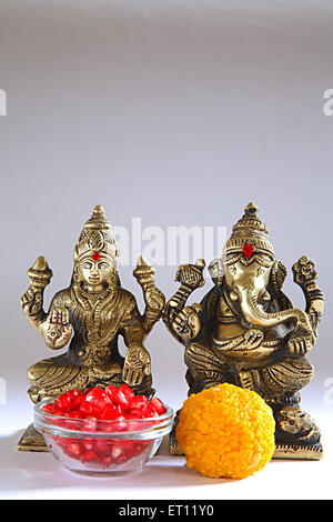Diwali deepawali festival ; shree lakshmi puja with god ganesh ; sweets offered ; India Stock Photo