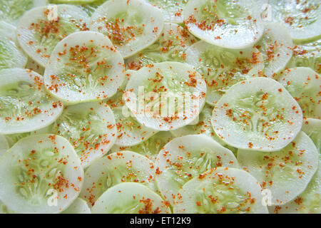 Cucumber slices with red chilly Stock Photo