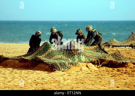 Indian Army capturing enemy bunker demonstration on Army day ;  Shankumugham Beach ; Trivandrum ; Thiruvananthapuram ; Kerala ; India Stock Photo