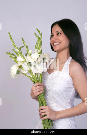 Christen bride in white gown holding flowers MR#733C Stock Photo