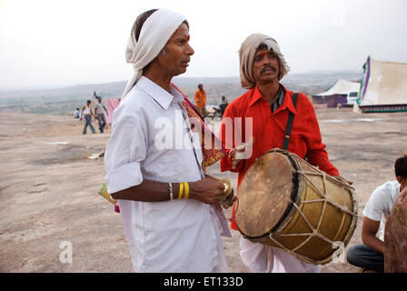 Men singing and playing musical instruments on Mahashivaratri festival at Keesaragutta temple ; Hyderabad ; Andhra Pradesh ; Telengana ; India Stock Photo