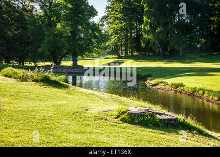 A typical golf course in early morning sunshine. Stock Photo