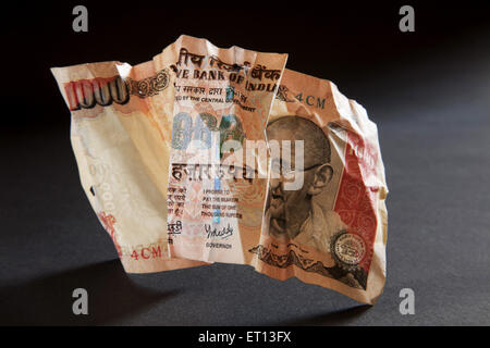 Indian money currency paper one thousand Rupee note 1000 crumpled Stock Photo