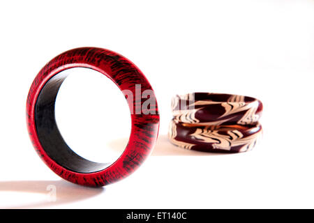 Colorful wooden bangles on white background Stock Photo