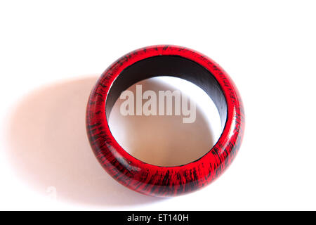 Black and maroon wooden bangle on white background Stock Photo