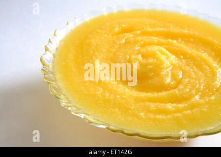 Ghee , clarified butter , in glass bowl on white background Stock Photo