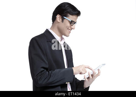 Man Texting on Tablet India Asia MR#790E Stock Photo
