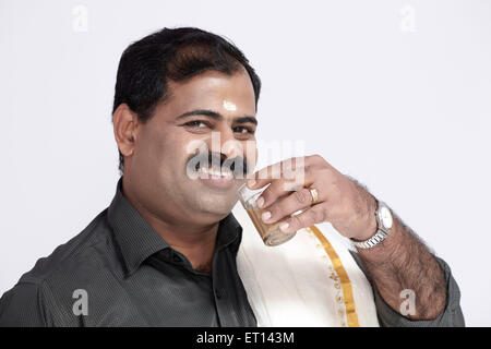 South Indian Man Drinking Tea India Asia MR#790E Stock Photo