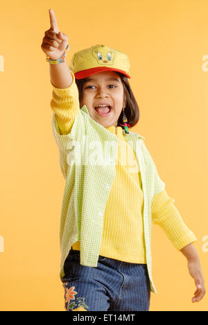Young girl raised arm pointing finger showing out sign MR#719D Stock Photo