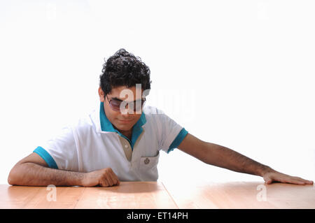 Man in goggles looking down MR#719F Stock Photo