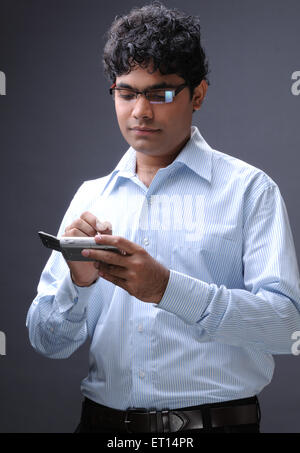 Man operating mobile phone MR#719F Stock Photo