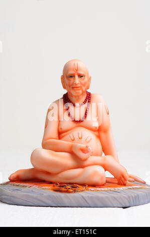 Clay statue of god shri swami samarth sitting on tiger skin Stock Photo