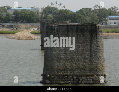 Dandong, LIAONNG PROVINCE, CHINA. 27th May, 2015. Korean, Japanese and Korean tourists visit the American bombed Yalu River Jiang Duan Qiao Bridge as trade continues with North Korea (background) and China in Dandong, China's larger border city with North Korea, in Liaoning Province, on May 27, 2015. China remains North Korea's most important ally, providing Pyongyang with most of its food and energy supplies and comprises over sixty percent of its total trade volume. North Korea's economic dependence on China continues to grow due to international sanctions, as indicated by the significant Stock Photo