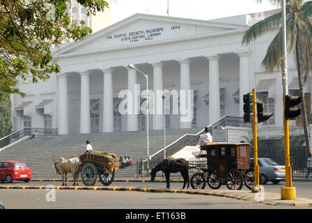 Bullock cart and horse driven cart standing in front of The Asiatic Society State Central Library Town Hall ; Bombay Stock Photo