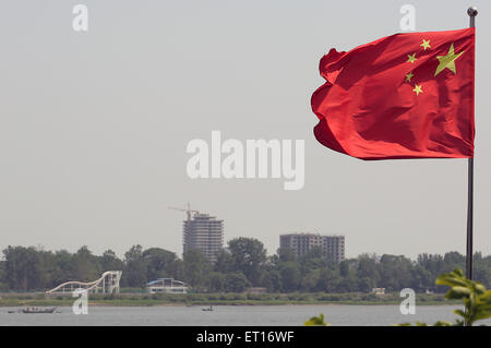 Dandong, LIAONNG PROVINCE, CHINA. 27th May, 2015. A water slide and new building projects are seen in the North Korean city Sinuiju, across the Yalu River from Dandong, China's larger border city with North Korea, in Liaoning Province, on May 27, 2015. China remains North Korea's most important ally, providing Pyongyang with most of its food and energy supplies and comprises over sixty percent of its total trade volume. North Korea's economic dependence on China continues to grow due to international sanctions, as indicated by the significant trade imbalance between the two countries. (Credi Stock Photo