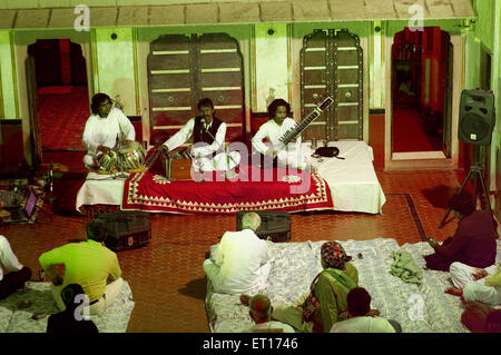 Musicians playing musical instruments harmonium tabla sitar ; Bikaner ; Rajasthan ; India Stock Photo
