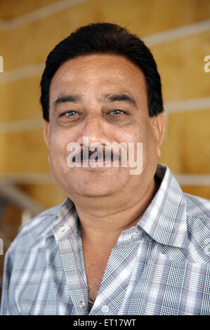 Man portrait face mustache smiling looking at camera India MR#784E Stock Photo