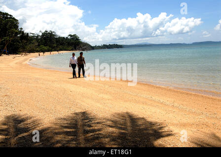 Couple walking, Radhanagar beach, Havelock Island, Andaman and Nicobar Islands, India, MR#736J&K Stock Photo