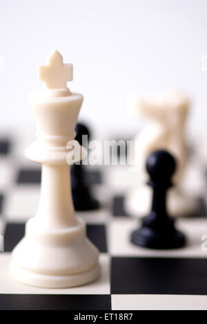 Chess game white king and black pawn Stock Photo