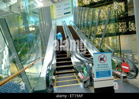 Interior of airport terminal and escalator ; Singapore MR#364 Stock Photo