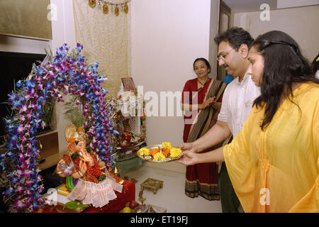 family Performing ganesha pooja mumbai Maharashtra India Asia MR#364 Stock Photo