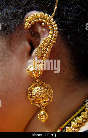 Part of Body Close up of Ear with Gold Ornament Stock Photo